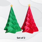 Sculpted Christmas Tree Décor Set (Set of 2) – Modern wavy tabletop ornaments, one green and one red with yellow stars, 3D printed for stylish holiday décor. Displayed on white background; text below reads Set of 2.